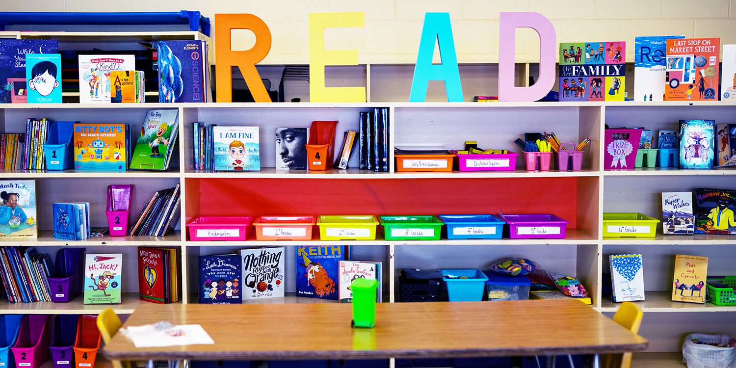 Reading wall with bookshelf and materials.