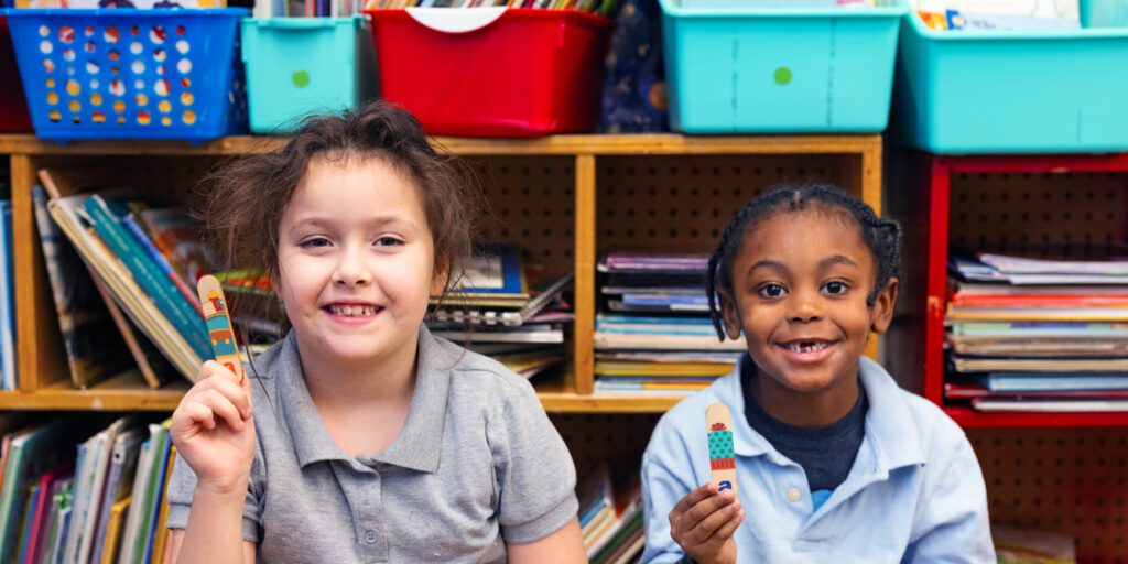 Students smiling in a classroom