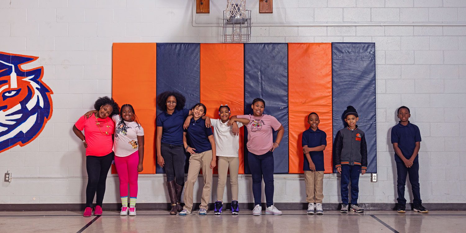 A group of smiling students at gymnasium