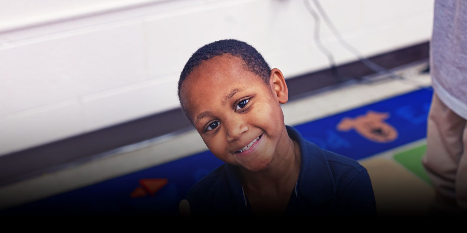 Student smiling in a class