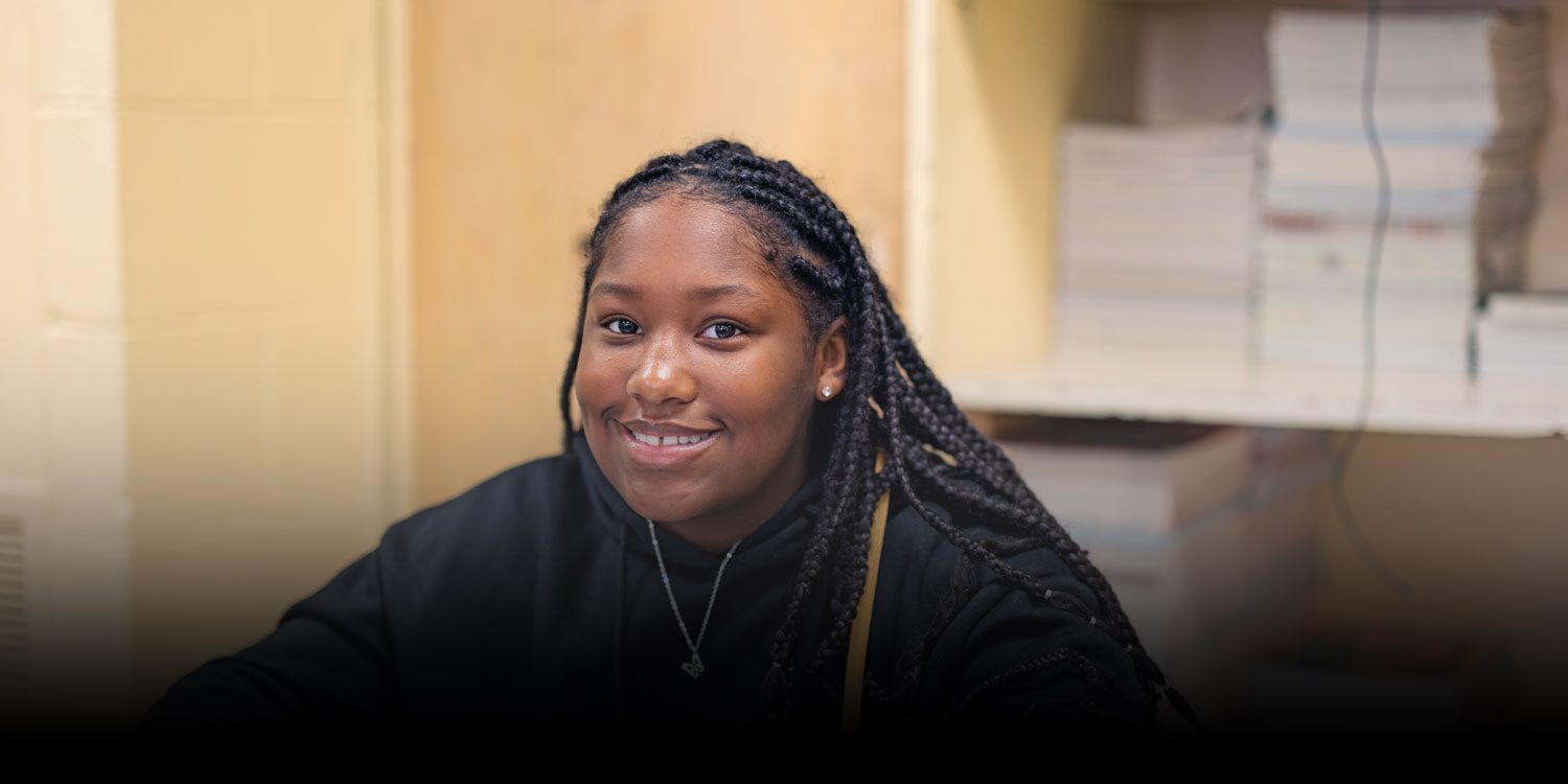 Student smiling in a class