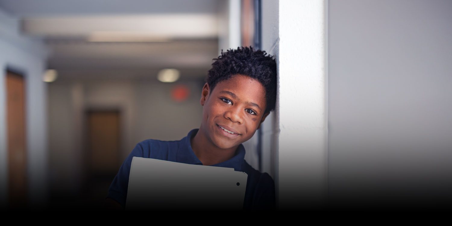 Smiling student in the hallway